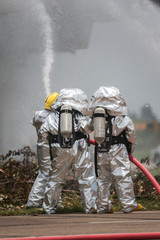 Obraz premium Fire departments & emergency response teams suited up with PPE t