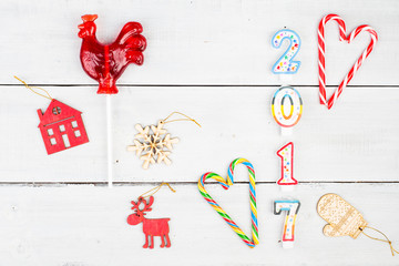 Inscription of the candles "2017", gift boxes, candy, Christmas House and other New Year's toys