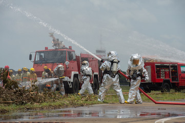 Obraz premium Fire departments & emergency response teams suited up with PPE t