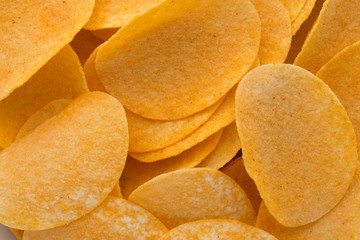 Close up potato chips on wood top view background.