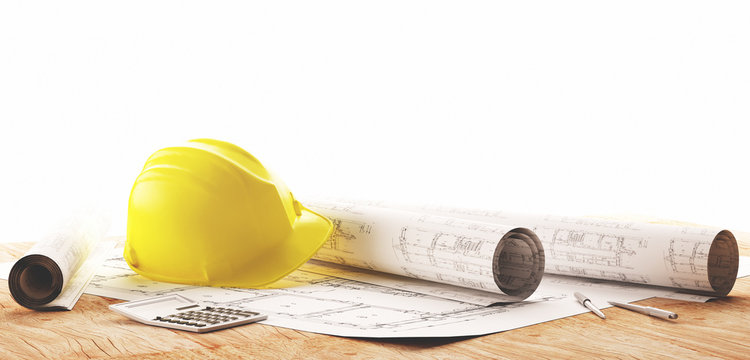 Elmetto giallo con progetti architetto per lavori in cantiere