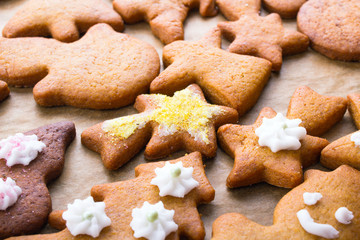 Colorful Christmas gingerbread cookies on  baking paper