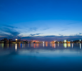 Fototapeta na wymiar Sea port after the sunset. Skyline.