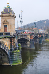 Prague, Czechia - November, 24, 2016: panorama of an old Prague, bridges and embankment of Vitava river, Czechia