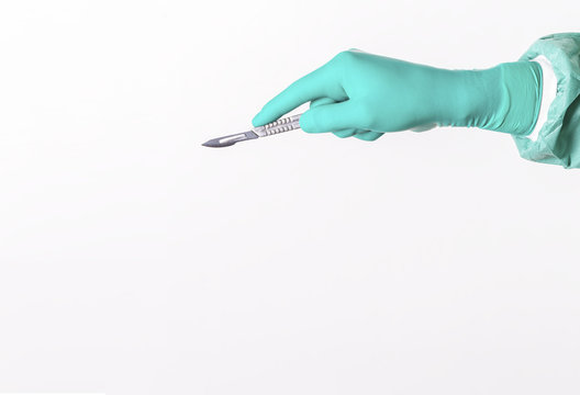 Surgeon hand witha scalpel