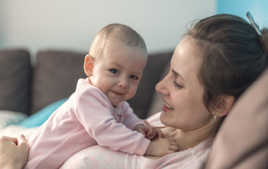 mother playing with her baby