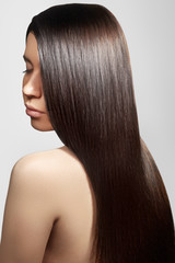 Beautiful woman with beautiful straight shiny hair, fashion makeup. Glamour make-up. Beautiful...
