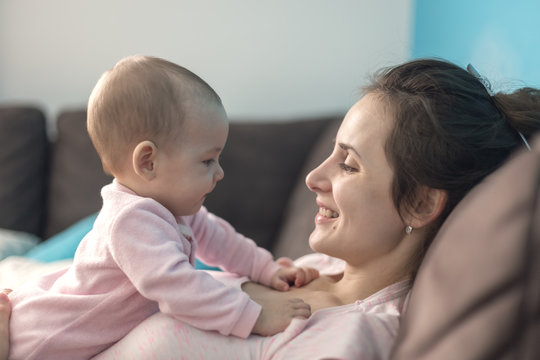 mother playing with her baby