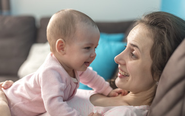 mother playing with her baby