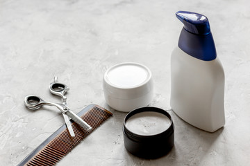 mens cosmetics for hair in bottle at bathroom