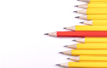 Pencils arranged horizontally in a jagged line with one standing out from the rest, with space for text - 128922268