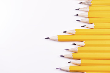 Pencils arranged in a jagged line horizontally with space for text - 128922287