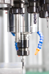 High precision CNC machining center working, operator machining