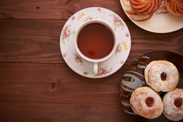 tea and sweets on a wooden table