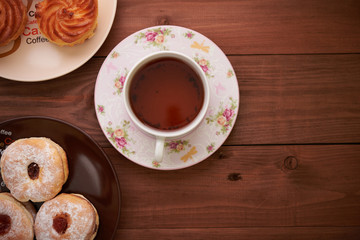 tea and sweets on a wooden table