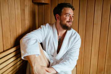 Healthy male in sauna relaxing