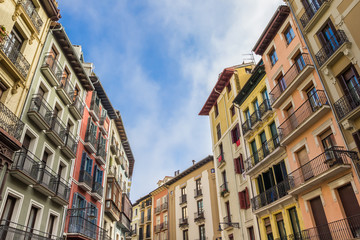 Fototapeta na wymiar Colorful apartment buildings in the center of Pamplona