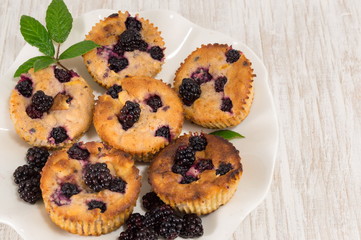 blackberry muffins on a plate