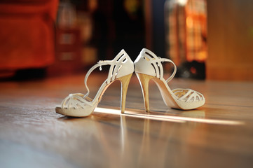 Heeled elegant wedding shoes on the floor
