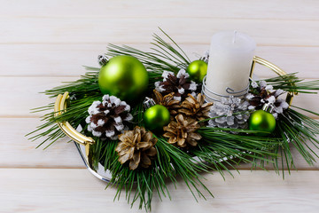 Christmas centerpiece with silver, snowy and bleached pine cones