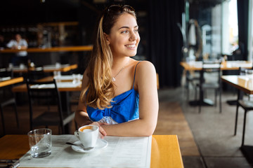 Beautiful woman enjoying her coffee