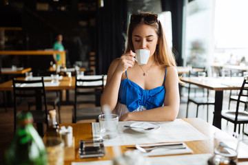 Stunning woman enjoying her coffee
