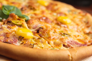 Concept: restaurant menus, healthy eating, homemade, gourmands, gluttony. Pizza carbonara on a wooden vintage table with ingredients. Detail