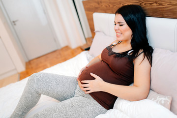 Painful expression on pregnant woman face