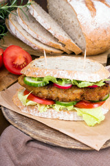 sandwich with fried meat and vegetables