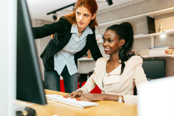 Busiensswoman advising colleague