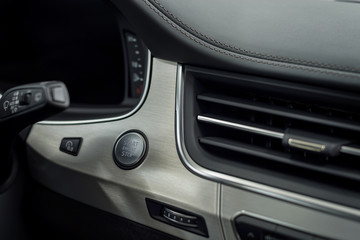 Fototapeta na wymiar Engine start stop button. Modern car interior detail.