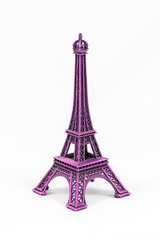 Fototapeta na wymiar Purple Eiffel Tower model, isolated on white background