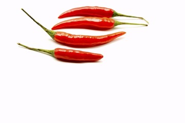 chilies pepper on white background,Chili pepper, the spicy fruit of plants in the genus Capsicum; sometimes spelled "chilli" in the UK and "chile" in the southwestern US.