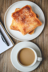 Breakfast Concept with Coffee Cup and Bread and The Book with Th
