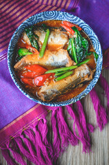 Stir Fried Chinese Kale with Canned fish on Thai Fabric and  Old