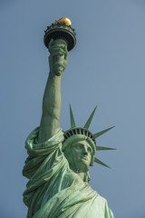 Fototapeta na wymiar Majestic iconic lady liberty statue of liberty in New York harbor welcoming new arrivals