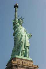 Fototapeta premium Majestic iconic lady liberty statue of liberty in New York harbor welcoming new arrivals