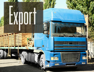 Truck loaded with wooden crates. Word EXPORT on background. Wholesale and logistics concept.