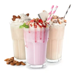 Fotobehang Glasses with delicious milk shakes on white background. © Africa Studio