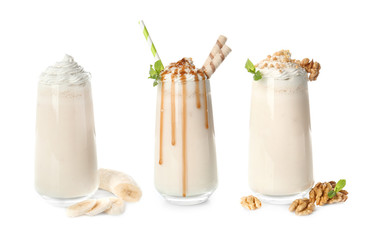 Glasses with delicious milk shakes on white background.