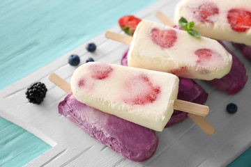 Tasty fruit ice-cream on cutting board