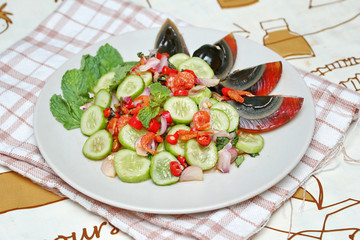 Close up spicy cucumber salad with dried-shrimp and  preserved e