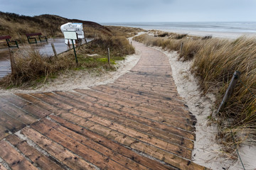 Wooden path through dunes to beach on German island Spiekeroog