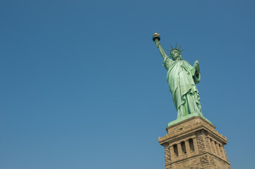 Fototapeta na wymiar Majestic iconic lady liberty statue of liberty in New York harbor welcoming new arrivals