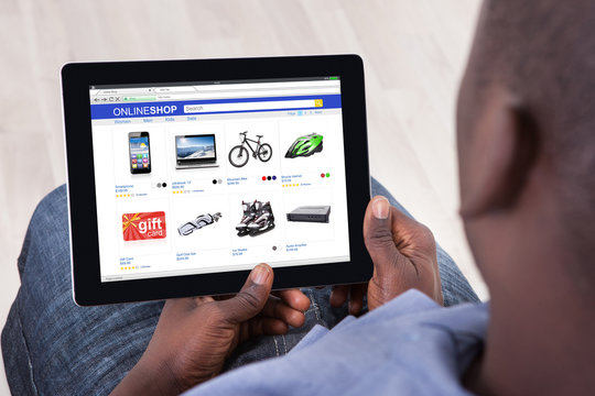 African Man Shopping Online On Digital Tablet