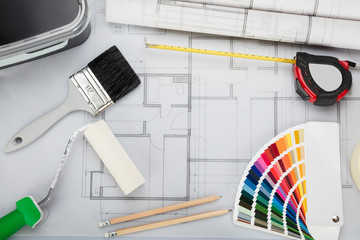 Blueprint With Tools And Equipment On Desk
