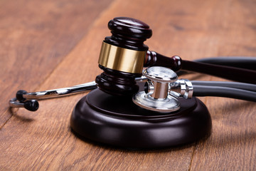 Close-up Of Gavel With Medical Stethoscope