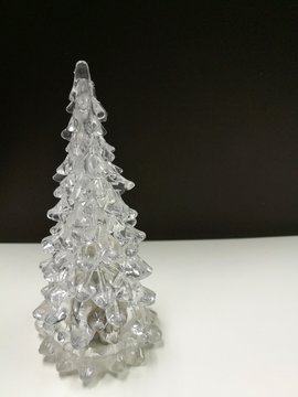 Merry Christmas and Happy New Year, white clear Xmas tree with brown background on the vertical side