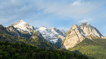 Fototapeta na wymiar Springtime morning snowy Alps mountains panoramic scenic view