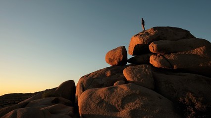 Man On top of giant rocks 